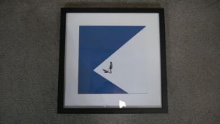A 20th century black flat framed and glazed colour print of a figure in an abstract landscape. H.
