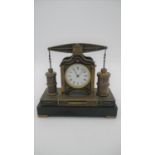 A 19th century French industrial mantel clock. Two industrial engine type pistons flank the clock.