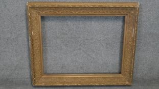 A 19th century carved giltwood frame with relief foliate and and laurel leaf borders. Rebate: H.51