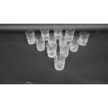 Two sets of six cut crystal whisky glasses with stylised foliate design, one set with a faceted