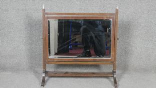 A 19th century mahogany and satinwood strung skeleton framed toilet mirror. W.64 D.28 H.60