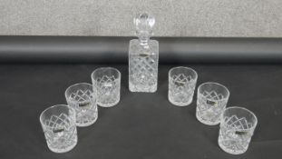 An Irena cut crystal decanter and six whisky tumblers. Makers labels on all. H.16cm
