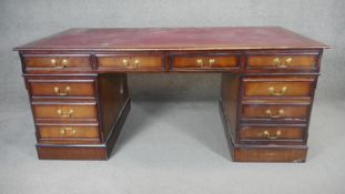 A large Georgian style mahogany three section pedestal desk. H.78 W.183 D.92cm