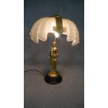 A gilt bronze 19th century table lamp of a female figure with a frosted glass shell shade. H.54 W.