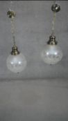 A pair of etched and frosted glass hanging ceiling lamps. Dia.25cm