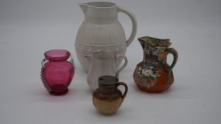 A collection of ceramics and glass. Including a cranberry glass vase, a Masons ironstone 19th