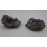 Two amethyst geode crystals.