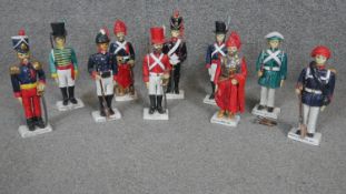 A collection of ten hand painted ceramic figures.