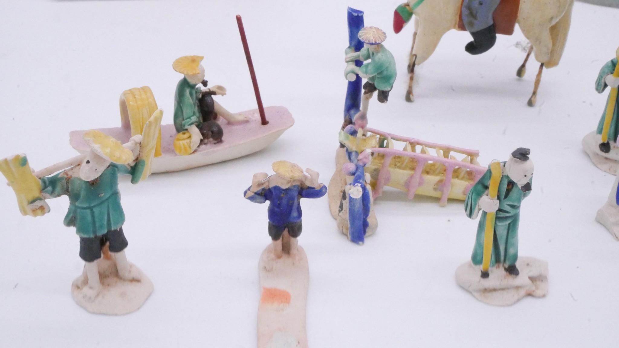 A collection of Chinese hand painted ceramic miniature figures along with a painted festival scene - Image 6 of 14