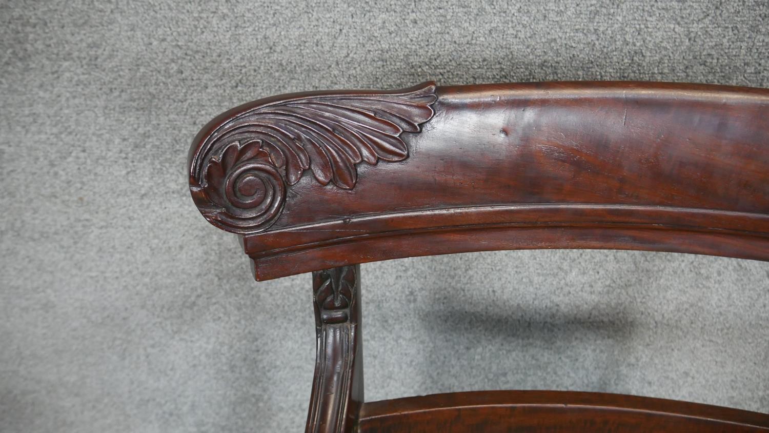 A Regency mahogany armchair with carved backrail and drop in seat on sabre supports. - Image 3 of 3