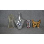 A collection of mannequins and masks. Including a vintage chrome effect clothes mannequin, a gilt