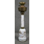 A Sherwood milk glass hand painted oil lamp. Gilded with ivy leaves, brass fittings and pierced