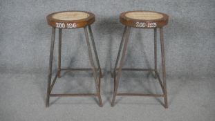 A pair of vintage metal framed science laboratory stools. H.58cm