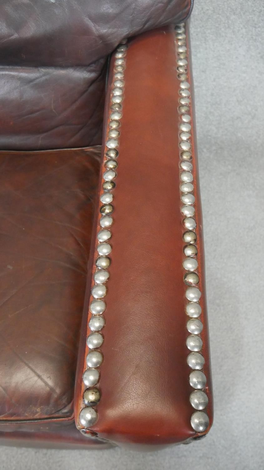 A pair of vintage library armchairs in studded tobacco leather upholstery. - Image 5 of 5