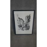 A framed and glazed limited edition signed etching of a town scene. Indistinctly signed. H.68 W.50cm