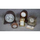 A collection of five vintage clocks. Including a Smith bakelite mantle clock, A mahogany John