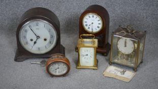 A collection of five vintage clocks. Including a Smith bakelite mantle clock, A mahogany John