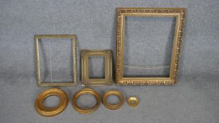 A collection of seven antique carved gilt frames. Including four round frames, one with foliate