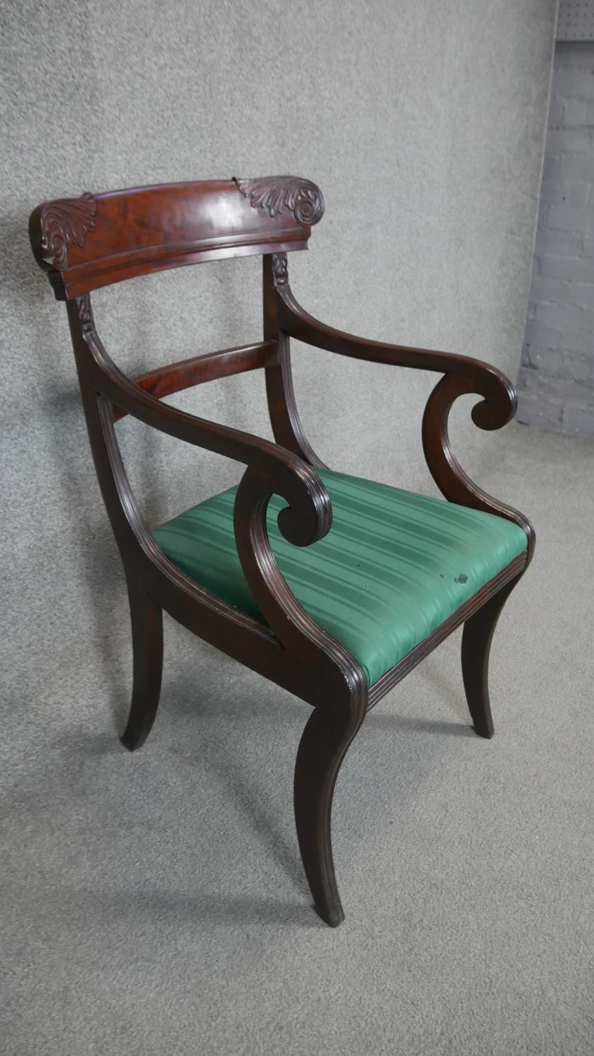 A Regency mahogany armchair with carved backrail and drop in seat on sabre supports. - Image 2 of 3