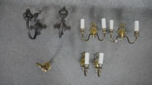 Three pairs of brass and copper wall lights and a single example. The copper lights with a