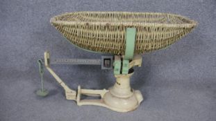 A set of vintage Avery baby scales with wicker basket. H.43 W.57cm