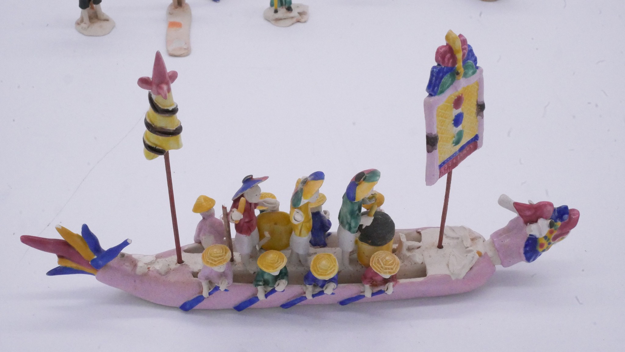 A collection of Chinese hand painted ceramic miniature figures along with a painted festival scene - Image 4 of 14