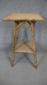 A vintage two tier bamboo occasional table. H.66 Dia.39cm