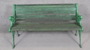 A vintage painted iron garden bench with slatted seat. H.73 x W.127 x D.60cm