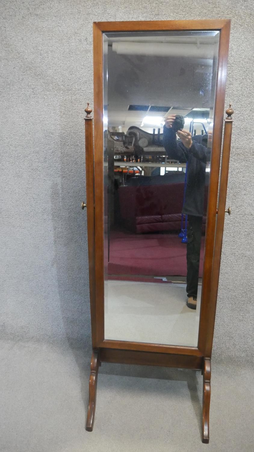 An Edwardian mahogany framed cheval mirror with bevelled plate. H.170cm