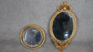 A 19th century carved giltwood wall mirror along with a circular example with it's original plate.