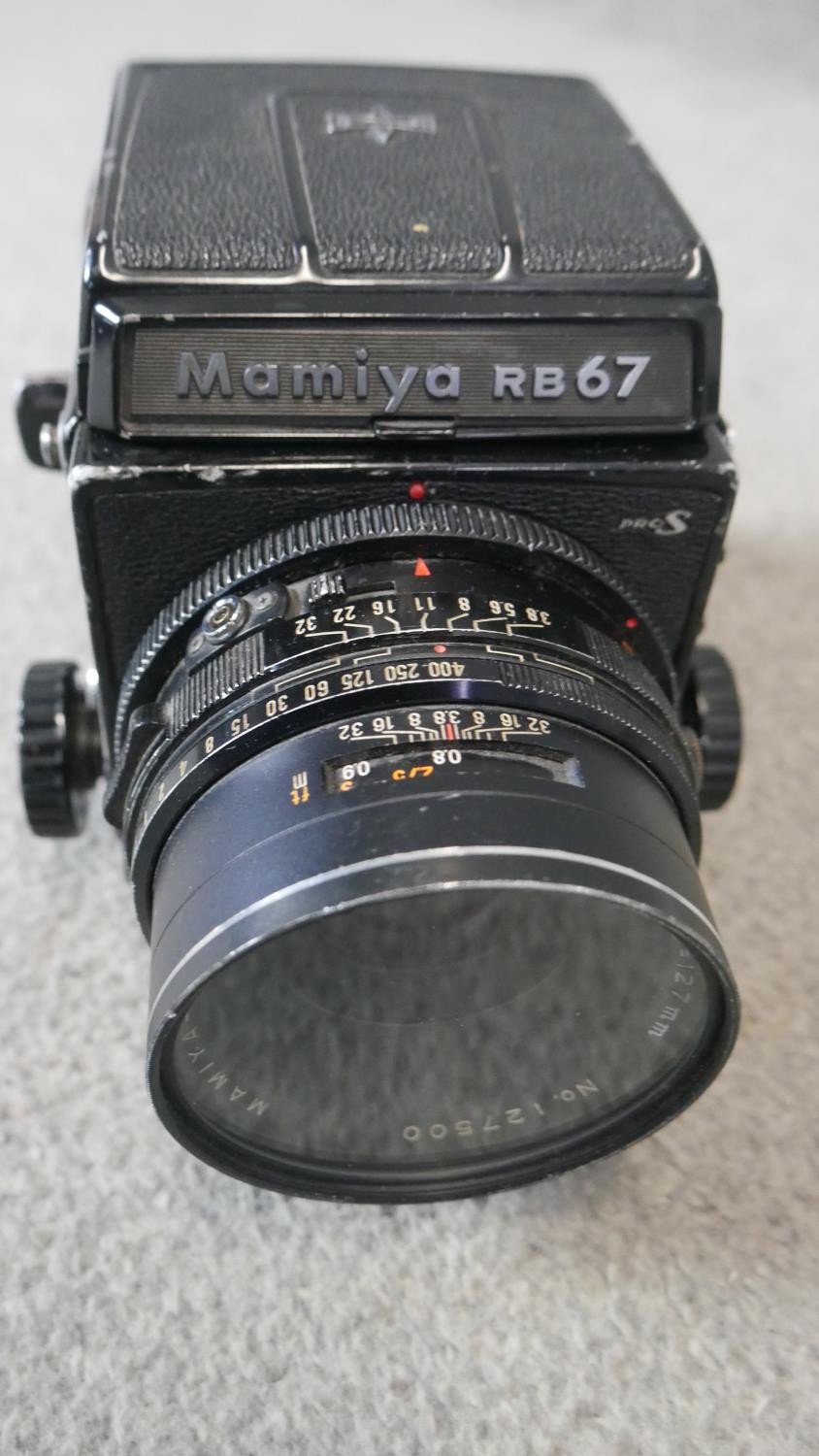 A Mamiya RB67 camera with metered prisms, lenses and film backs with brown leather carrying case. - Image 2 of 5