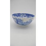 A 19th century large blue and white transfer printed ceramic bowl with unglazed foot. Interior