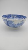 A 19th century large blue and white transfer printed ceramic bowl with unglazed foot. Interior