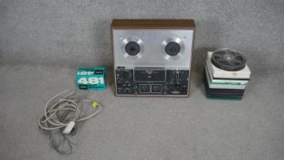 A teak and chrome Sony three head tape recorder with selection of reel to reels. H.40 W.42