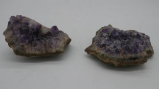 Two amethyst geode crystals.