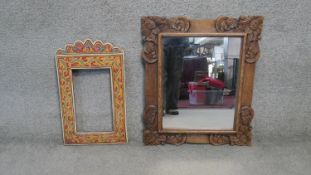 A painted frame with floral design along with a carved foliate design Oriental mirror. H.70 W.59CM