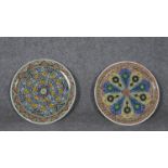 Two Islamic glazed chargers with abstract design. (Chip to one rim).