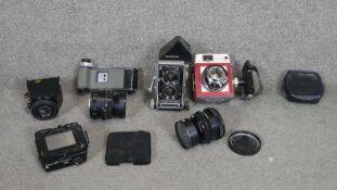 A Mamiya C33 poroflex camera, a Mamiya 23 standard camera with various lenses and acessories.