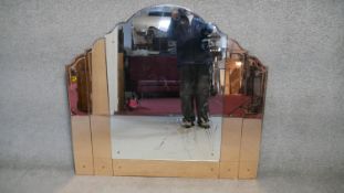 An Art Deco overmantel mirror with shaped etched central plate flanked by peach glass panels. H.