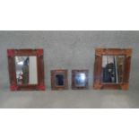 A pair of carved and painted Eastern teak wall mirrors and two similar smaller mirrors. H.60 W.33CM