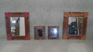 A pair of carved and painted Eastern teak wall mirrors and two similar smaller mirrors. H.60 W.33CM