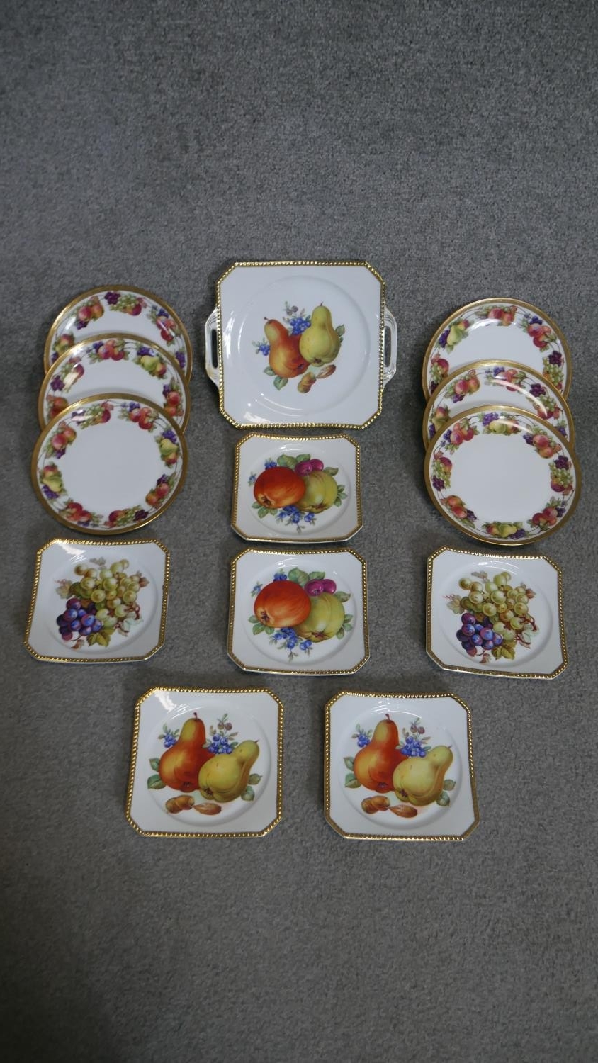 A collection of porcelain transfer fruit design plates, two different makers. (13 pieces in total)