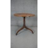 A 19th century mahogany tilt top table on turned column and tripod supports. H.73 Dia.73cm