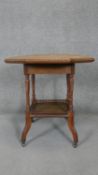 A late 19th century walnut occasional table on shaped supports united by galleried undertier. h71