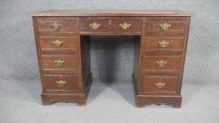 A 19th century walnut pedestal desk with inset gilt tooled leather top on bracket feet. H.81 W.122