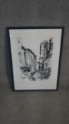 A framed and glazed limited edition signed etching of a town scene. Indistinctly signed. H.68 W.50cm