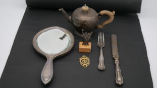 A collection of silver. Including a silver teapot Edward and Sons, 1935, a silver backed mirror, a