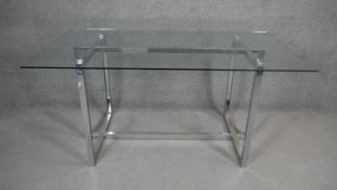 A Pieff style dining table with plate glass top and chrome base. H.76 W.16 D.90