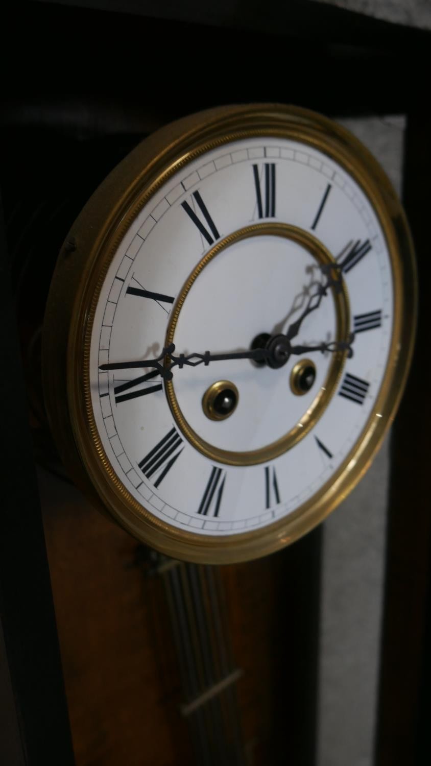 A 19th century Vienna regulator wall clock with eight day movement and white enamel dial in a carved - Image 6 of 6