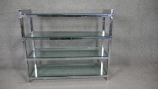 A vintage style chrome framed four tier etagere with plate glass shelves. H.84 W.97 D.36cm